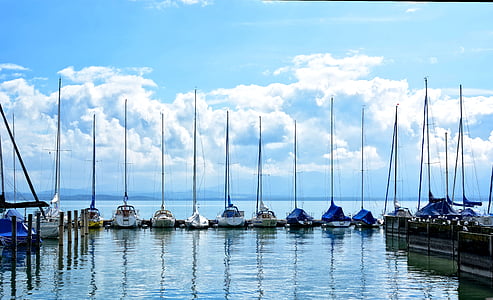 assorted-color boat lot on body of water thumbnail