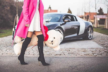 Elegant Woman Holding Big Teddy Bear with Red Heart thumbnail