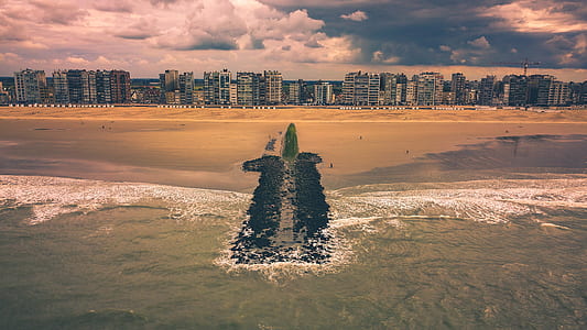 landscape photography of building near body of water thumbnail