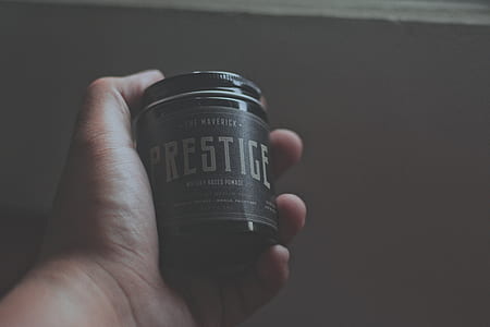 person holding prestice labeled bottle thumbnail