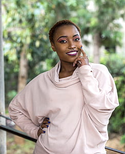 Woman Wearing Brown Sweater thumbnail