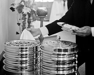 grayscale photo of person holding plate thumbnail