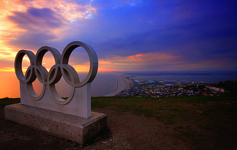 concrete Olympic logo on cliff thumbnail
