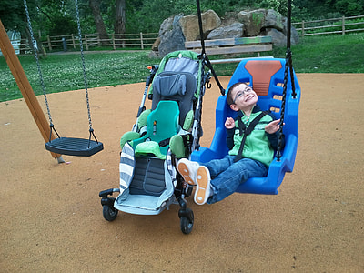Boy in blue hanging swing thumbnail