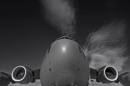 grayscale photo of plane under sky thumbnail