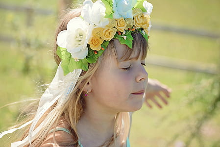 girl in blue spaghetti strap dress with white and yellow roses headband thumbnail