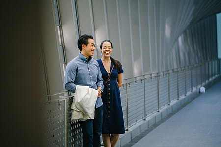 Man And Woman Leaning On Hand Rail thumbnail