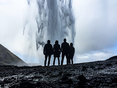 four person standing near body of water thumbnail
