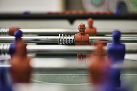 shallow focus photography of foosball table thumbnail