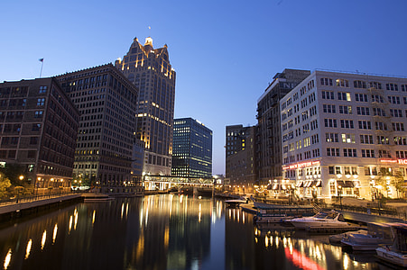 river in between high rise buildings in the city thumbnail