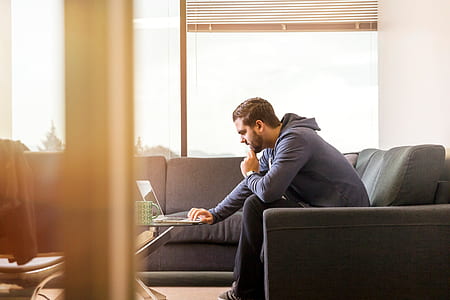 man using laptop computer indoor thumbnail
