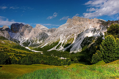 landscape photography of green fields and mountains thumbnail