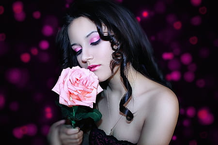 woman holding pink rose flower thumbnail