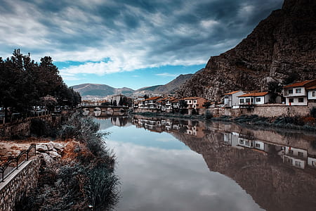house beside body of water thumbnail