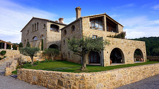 beige stone 2-storey house during daytime thumbnail