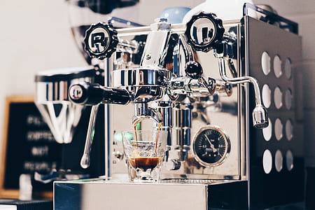 silver espresso maker near black coffeemaker thumbnail