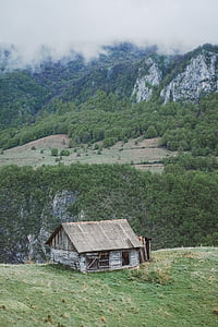 gray concrete house near cliff thumbnail