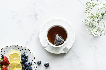 white ceramic mug on white table thumbnail