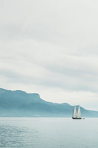 brown and white boat sailing on ocean thumbnail