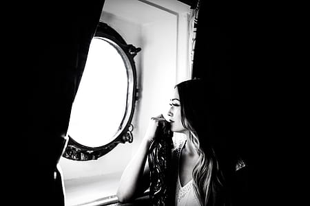 woman looking at window thumbnail