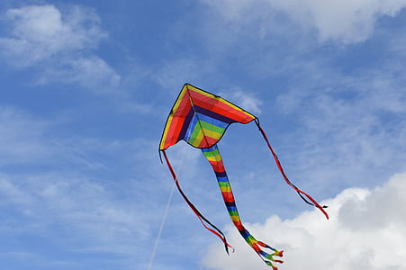 green, orange, and blue kite on sky thumbnail