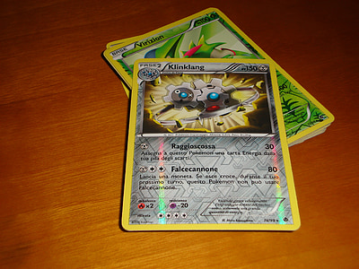 two Pokemon Klinklang and Virizion trading cards thumbnail