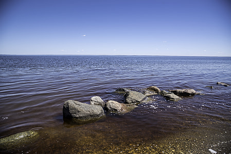 Rocks in the shallow water at Lake Winnipeg thumbnail