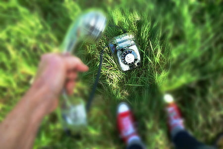 selective focus photography of cradle telephone on grass thumbnail
