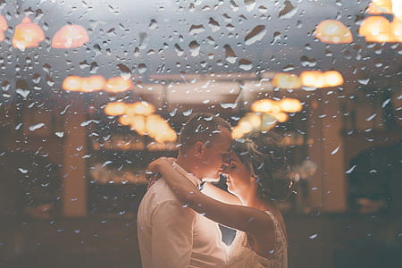 water dew photography of couple standing and about to kiss thumbnail