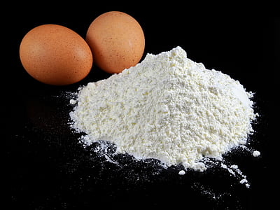 two brown eggs and white powder thumbnail