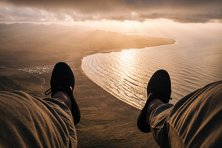 aerial angle photo of person facing seashore thumbnail