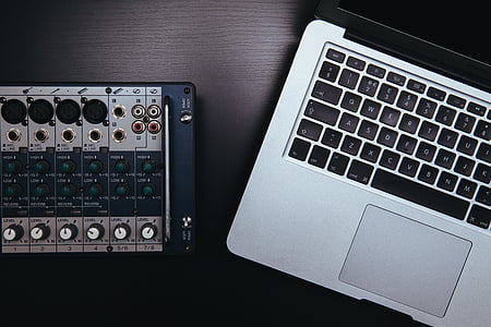 closed MacBook Pro on brown wooden table thumbnail