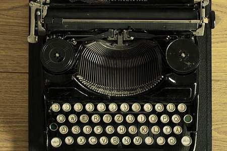 top-view photography of black typewriter thumbnail