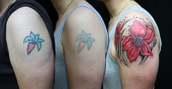 three men with carrot and flower shoulder tattoos thumbnail