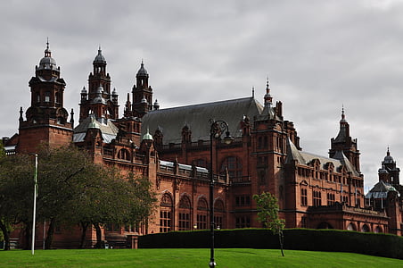 long-angle photography of brown palace under nimbus clouds thumbnail
