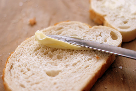 person putting butter on slide thumbnail