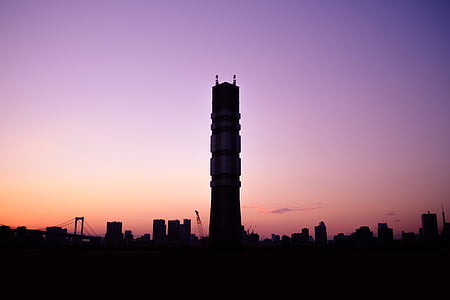 silhouette photo of black concrete high rise building thumbnail