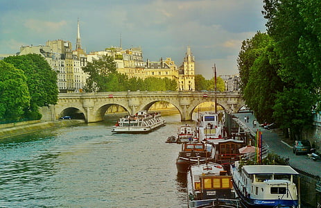 boats in river near viaduct at daytime thumbnail