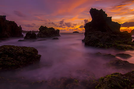photograph of rock formations during golden hour thumbnail
