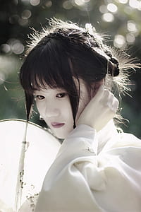 woman in white top with white makeup thumbnail