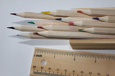 color pencil and ruler on white surface thumbnail