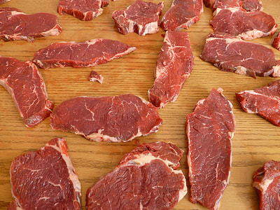 raw meat on the brown wooden surface thumbnail
