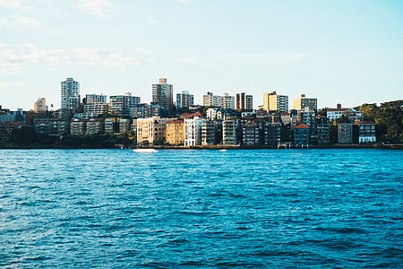 high-rise buildings near sea during daytime thumbnail