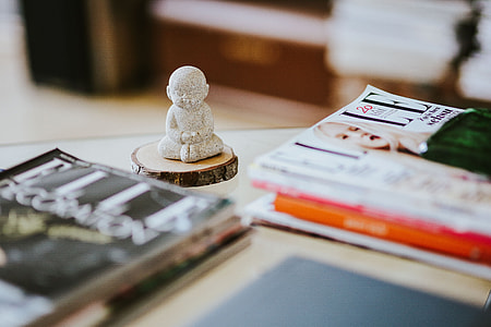 Laptop, a smartphone, magazines and cups of coffee on a table thumbnail