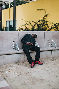 man sleeping on bench thumbnail