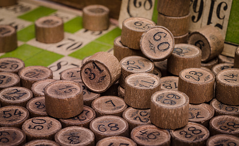 close-up photo of round brown board game pieces thumbnail