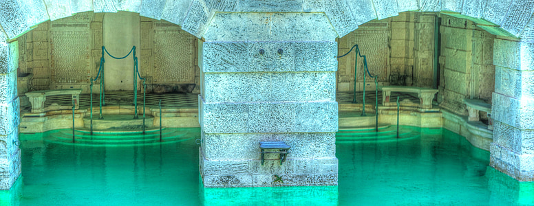 pool under gray concrete building thumbnail