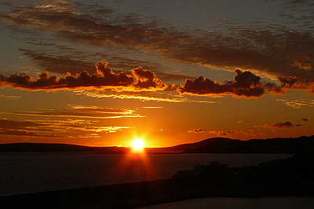 silhouette of mountain during golden hour thumbnail
