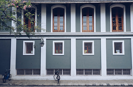 two bicycle in front of a two-storey house thumbnail