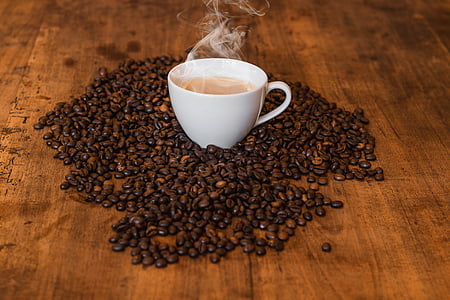 white ceramic cup and coffee beans thumbnail